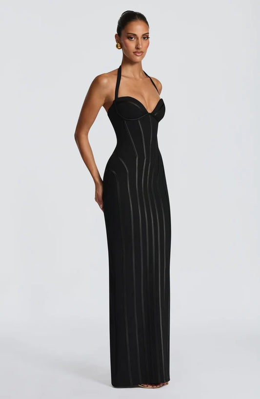 Side view of the Revalline Nigella Maxi Dress highlighting the premium fabric, flowing silhouette, and sophisticated style.