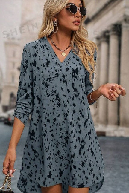 Allover print casual tunic dress for women with roll up sleeves and high low styling, designed for a chic and versatile wardrobe look