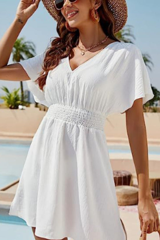 Women's casual V neck pleated dress with elegant flowy silhouette from Revalline fashion collection