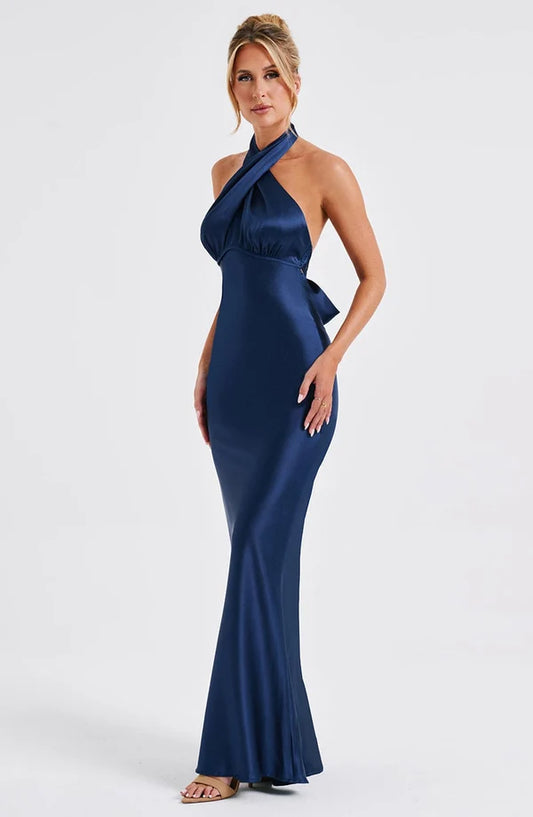 Side profile of the Revalline Dimitra Maxi Dress displaying its flowing silhouette and premium craftsmanship for modern women's fashion.
