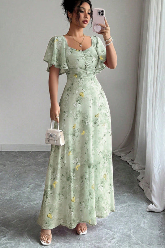 Women's floral print lotus sleeve midi dress front view with elegant midi silhouette, stylish occasion dress for weddings, brunch, vacations and parties by Revalline.
