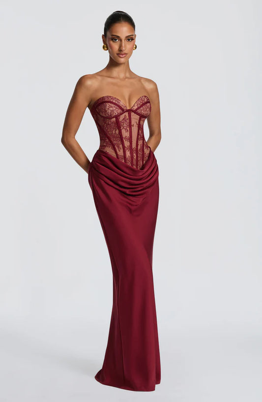 Side profile of the Revalline Kathleen Maxi Dress highlighting its graceful drape, flattering fit, and sophisticated design.