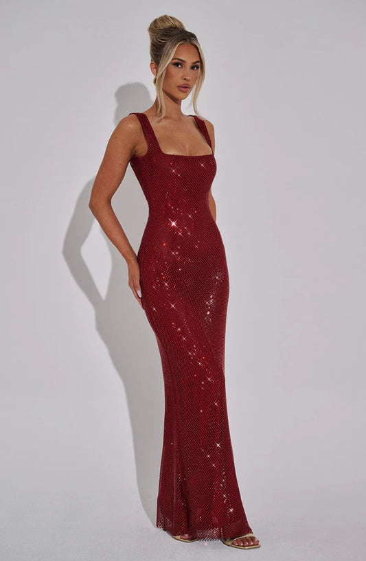 Side view of the Revalline Petra Maxi Dress highlighting its graceful silhouette and elegant design