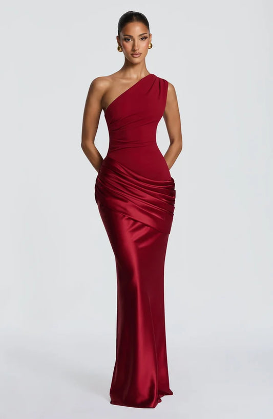 Front view of the Revalline Sadona Maxi Dress featuring a one shoulder neckline, pleated bodice and elegant floor length silhouette.