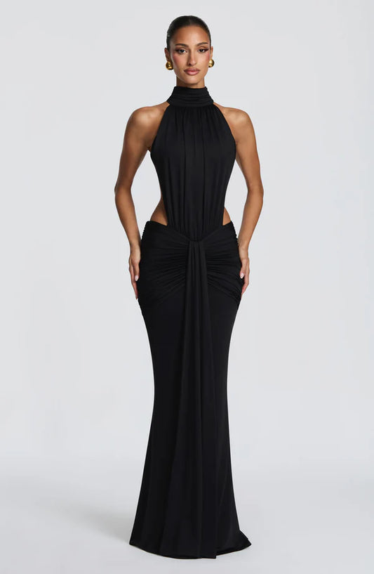 Thekla Maxi Dress by Revalline featuring a ruched bodice, open back, and elegant mermaid silhouette for formal occasions
