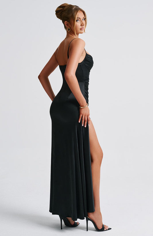 Side profile of the Winona Maxi Dress highlighting its flowing silhouette and premium design for evening wear